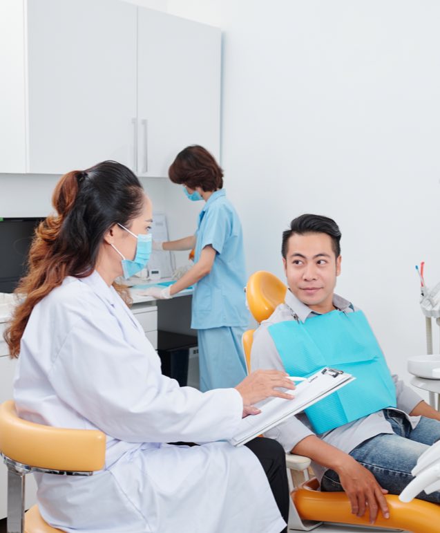 Patient talking to Female Dentist