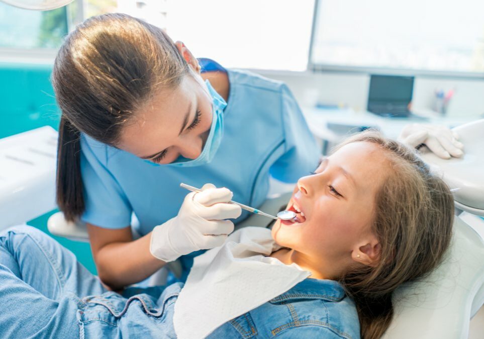 Young Girl Getting Teeth Examined